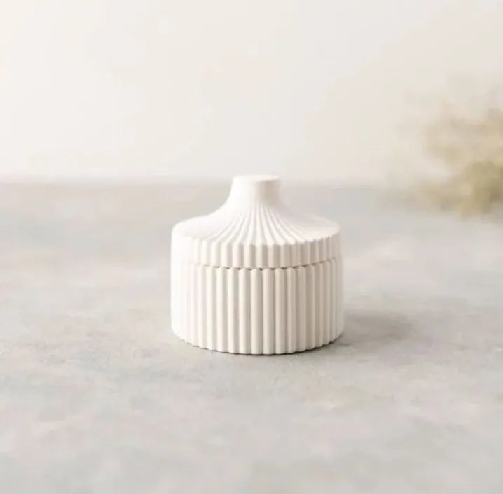 White ribbed vase on a light gray surface with a neutral background
Set of 3 Home Decor – Jewelry Box, Mini Vase & Oval Tray